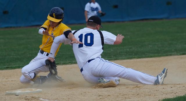 Shoreham-Wading River pinch runner Alex Bettenhauser is tagged out at third in Friday's semifinal loss at John Glenn. (Credit: Robert O'Rourk)