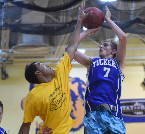 Shoreham-Wading River senior Jonah Caldwell blocks the shot of Mattituck's Josh Conklin Thursday. (Credit: Robert O'Rourk)