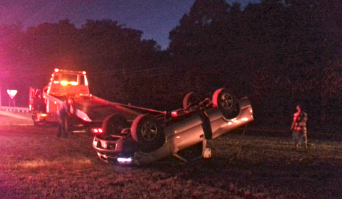 A pick-up truck flipped after colliding with a car near the intersection of Route 58 and Northville Turnpike Monday night. (Credit: Jennifer Gustavson)