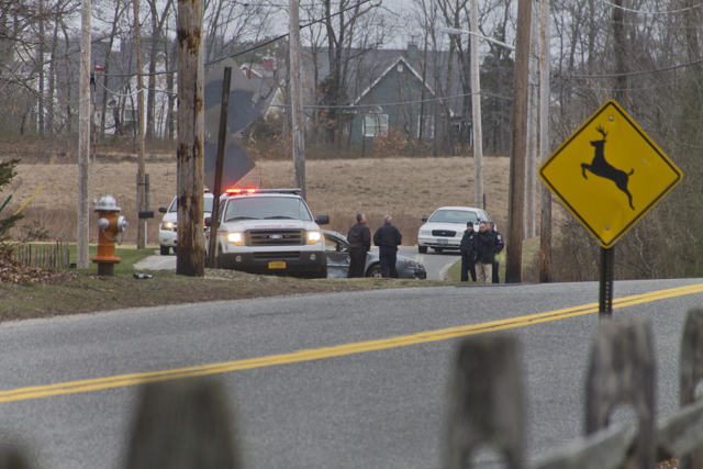 Police investigate the scene of Thursday afternoon's accident on Middle Road. (Credit: Paul Squire)