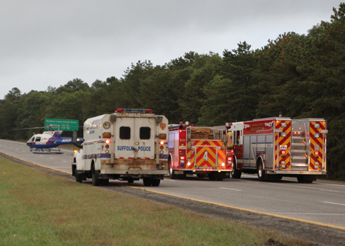 A Suffolk County Police helicopter landed on the eastbound LIE to transport the victim of a crash Tuesday. (Credit: Jen Nuzzo)