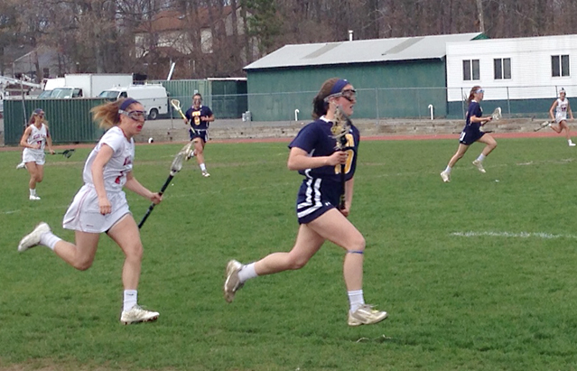 Sam Higgins races up field with the ball for Shoreham-Wading River Monday in the Wildcats win over Miller Place. (Credit: Joe Werkmeister)