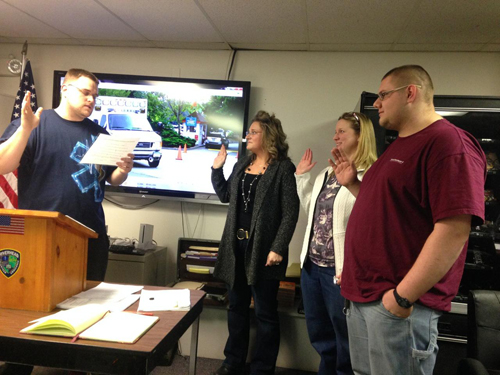 LISA CORWIN COURTESY PHOTO | (L-R) Chief Joseph Oliver sweats in Mai Hennessey, Kristen Murphy and Jake Phillips.