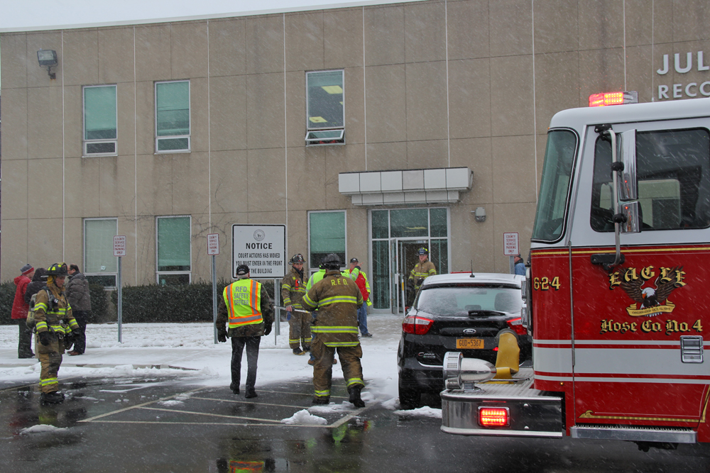 Volunteers respond to the Juliette Kinsella Records Storage Center Monday afternoon. (Credit: Carrie Miller)