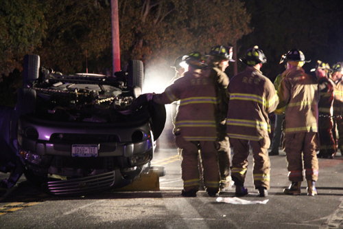 CARRIE MILLER PHOTO | About 50 fire department volunteers were called to the scene of the rollover accident Monday night.