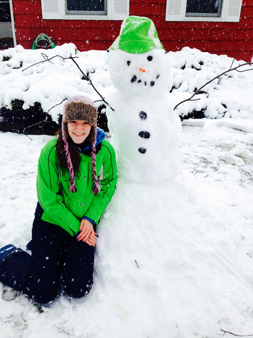 Angelika Osiniak enjoys a snow day on Ostrander Avenue in Riverhead.