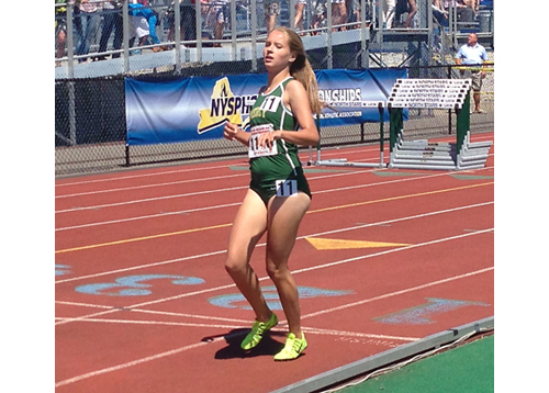 McGann-Mercy sophomore Meg Tuthill crosses the finish line after running the 1,500 Saturday. (Credit: Joe Werkmeister)