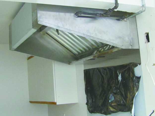 JULIE LANE FILE PHOTO | The oven hood was installed in the Senior Activity Center kitchen in November, but still one more step remains before the county can sign off on the facility.