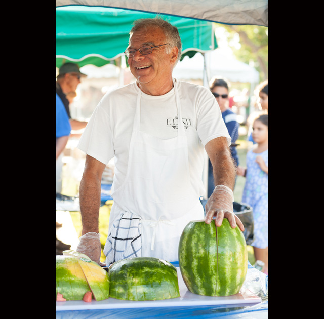 Bob Jester serves up some watermelon.