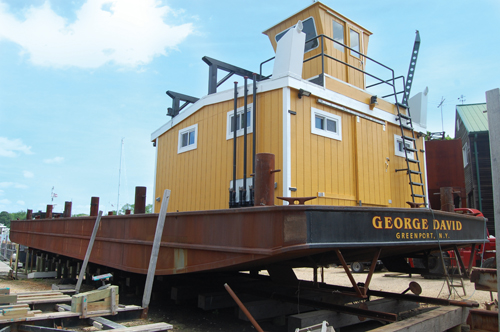 John Costello, owner of Costello Marine Contracting, began working on this barge with his brother, George David Costello, before his brother died suddenly in December 2012. He’s since named the barge after George. (Credit: Vera Chinese)