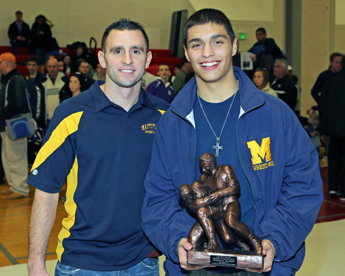 Mattituck Wrestling Coach Cory Dolson with Bobby Becker who was named Champion of Champions in the Suffolk County Division II wrestling championships were held at Center Moriches High School on Feb. 15, 2014. (Photo credit: Daniel De Mato)