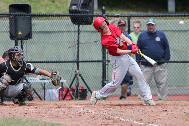 Noah Mina hits the ball hard against Tuckahoe. (Credit: Daniel De Mato)