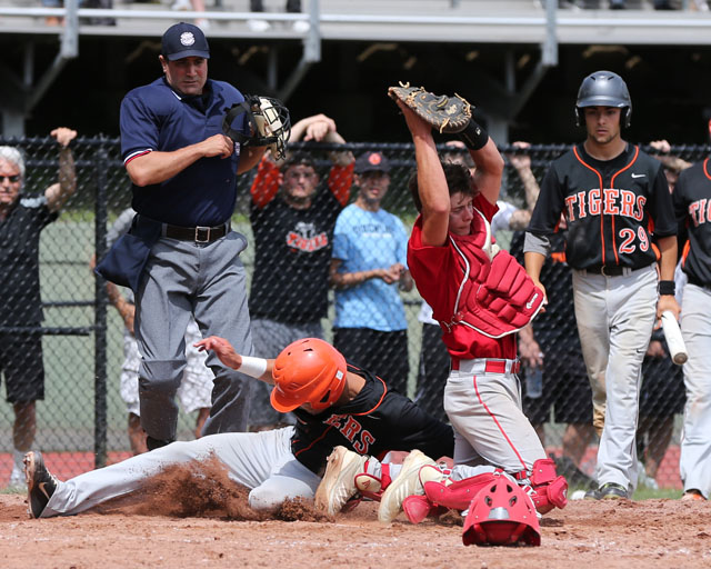 Tuckahoe's Sebastian Santorelli slid below the throw as catcher Sean Moran fields the ball. (Credit: Daniel De Mato)