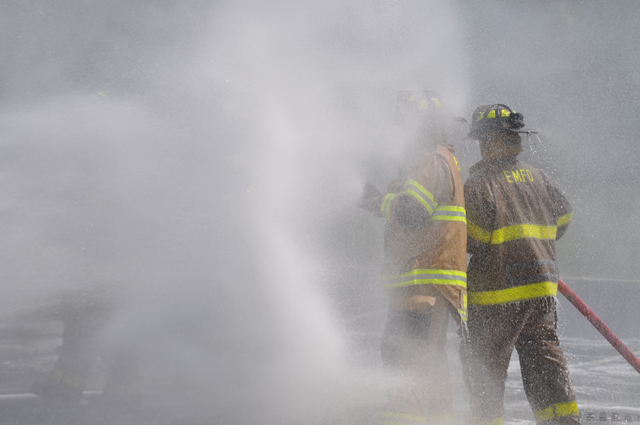 Southold, Cutchogue and East Marion fire department volunteers hosed down Southold's two new trucks and each other Sunday afternoon. (Credit: Grant Parpan)