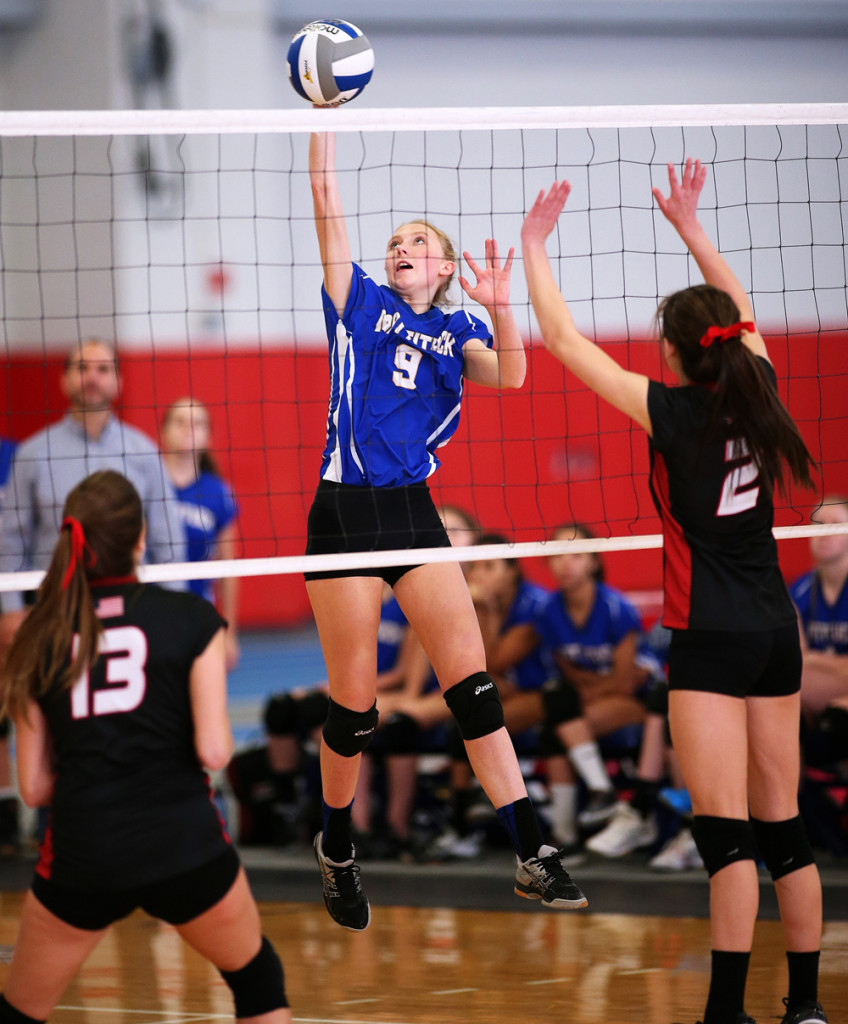 Senior Dawn Rochan looks to slip one past two opponents.