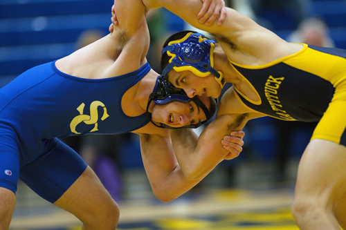 GARRET MEADE PHOTO | Matt Migliore of Smithtown Christian, left, and Christian Angelson of Mattituck/Greenport locked horns at 152 pounds. Migliore won, 6-3.
