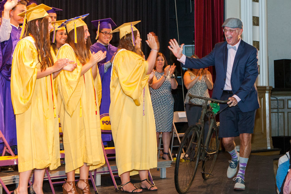 Beloved history teacher Ron McEvoy made a spectacular entrance at Sunday's graduation.
