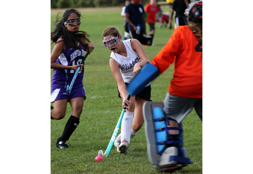 Greenport/Southold freshman Madison Hilton pushing the ball forward and closing in on Hampton Bays goalie Ashlyn Von Bartheld. (Credit: Garret Meade)
