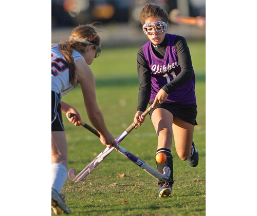GARRET MEADE PHOTO | Babylon's Hannah Walsh, left, and Greenport/Southold's Toni Esposito crossing sticks as they cross paths during Thursday's final regular-season game for both teams.