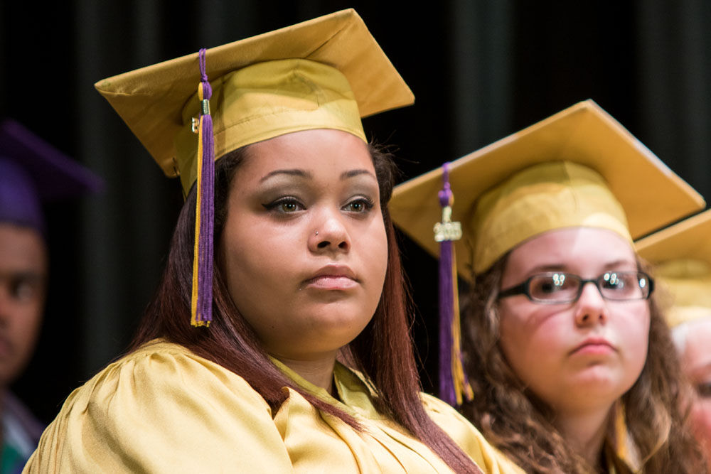 A graduate reflects on a speech during the ceremony.