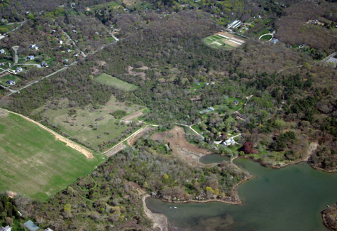 Sylvester Manor Shelter Island The woods, fields, buildings and 18th century manor house (close to Gardiners Creek shoreline at lower right) at Sylvester Manor on Shelter Island.