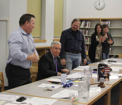 JENNIFER GUSTAVSON PHOTO | The Mattituck school board applauding Superintendent James McKenna moments after he announced his plans to retire.