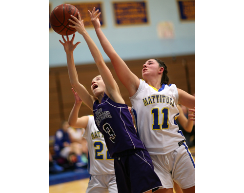 Port Jefferson's Jillian Colucci and Mattituck's Courtney Penny reach for a rebound. (Credit: Garret Meade)