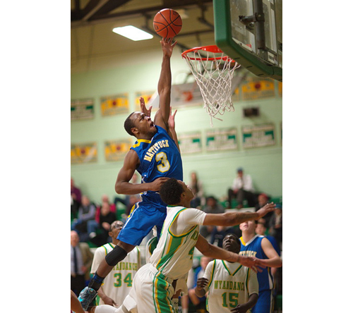 Mattituck's Gene Allen rises above the rim for an attempt at the basket during his team's loss to Wyandanch in an outbracket playoff game. (Credit: Garret Meade)
