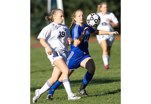GARRET MEADE PHOTO | Stony Brook's Sydney Dunn, left, and Mattituck's Abby Graeb trying to gain control of the ball.