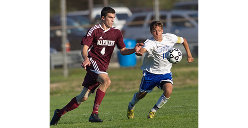 GARRET MEADE PHOTO | Southampton's Elliot LaGuardia and Mattituck's Paul Hayes in pursuit of the ball.