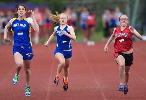 GARRET MEADE PHOTO | Mattituck's Sarah Goerler, center, competing in the 100 meters in the Hampton Invitational.