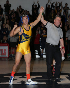 DANIEL DE MATO PHOTO | Bobby Becker's left arm is raised after winning the county title at 138 pounds. He dedicated his season to his mother Susan, who was recently diagnosed as having leukemia.
