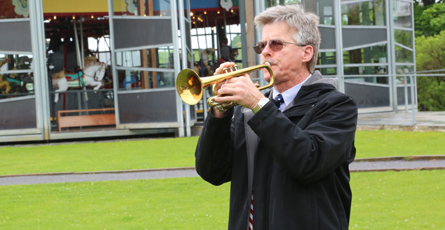 Colin Van Tuyl plays 'Taps' in Mitchell Park. (Credit: Grant Parpan)