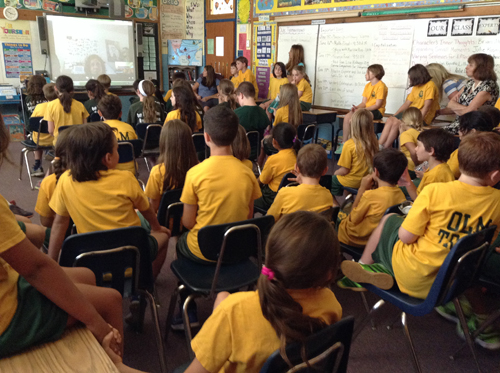 Our Lady of Mercy students talking with author tk. (Credit: Courtesy)