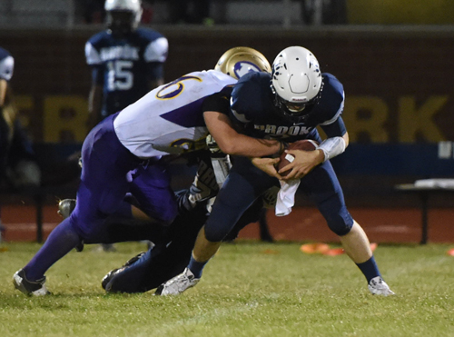 John Drinkwater sacks QB Erik Holvik for and eight yard loss late in the game. (Credit: Robert O'Rourk)