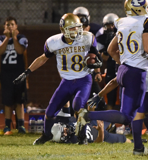 Greenport's Dominic Panetta looks for running room after an interception. (Credit: Robert O'Rourk)