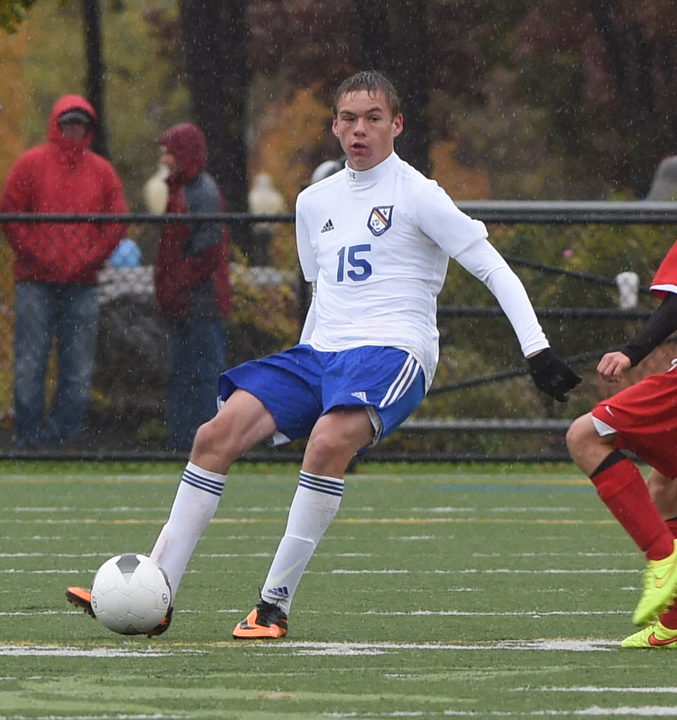Erik Schwartz handles the ball amid the downpour Saturday. (Credit: Robert O'Rourk)