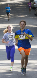 KATHARINE SCHROEDER PHOTO | Melanie Pfennig of Cutchogue, the top female finisher, was on the heels of Rex Spielman of Cutchogue near the finish line. Spielman was eighth in the men's race.