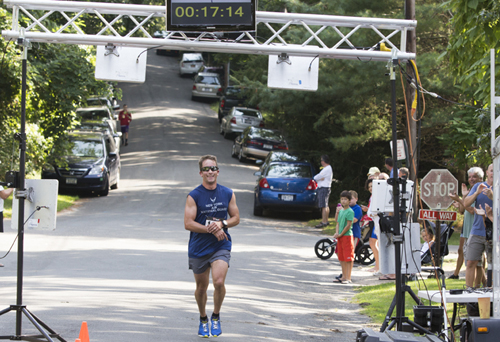 KATHARINE SCHROEDER PHOTO | Shawn Fitzgerald of Cutchogue was the first to reach the finish line in 17 minutes 15.01 seconds.