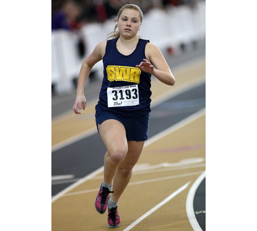 Shoreham-Wading River eighth-grader Lexie Smith running in the frosh/soph 1,500-meter race. (Credit: Garret Meade)