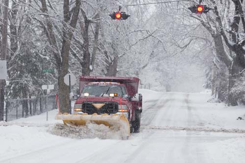 KATHARINE SCHROEDER PHOTO | A plow makes its way down New Suffolk Road in Cutchogue.
