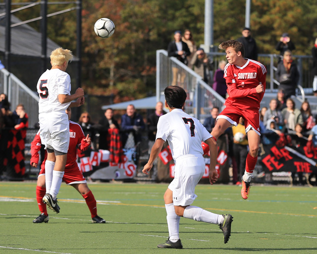 Southold's Joseph Silvestro heads the ball toward Pierson's Ariel Quiros during Southold's 1-0 loss to Pierson in the Class C finals at Diamond in the Pines in Coram Saturday. (Credit: Daniel De Mato photos)