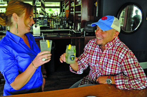 First and South Greenport restaurant GIANNA VOLPE PHOTO | First and South owners Sarah Phillips and Peter Pace in their Greenport restaurant Monday.