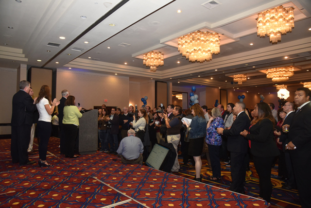 A somber crowd of Democratic supporters watch as Congressman Tim Bishop concedes Tuesday night. (Credit: Robert O'Rourk)