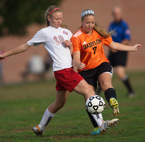 GARRET MEADE PHOTO | Southold/Greenport midfielder Megan Van Bourgondien fights for the ball against Babylon's Hallie Merz Tuesday afternoon.