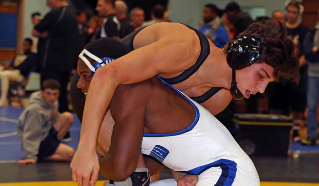 Mattituck's Tanner Zagarino (top) wrestles against Raheem Brown of Riverhead Saturday in the 170-pound finals of the North Fork Invitational. (Credit: Daniel De Mato)