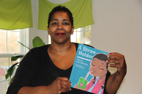 CARRIE MILLER PHOTO | Newly published author Joyce McKenzie said her book, “A Straw Holder,” is based on her granddaughter who loses her first tooth.