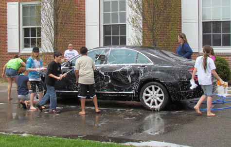Oysterponds fifth- and sixth-graders organized a car wash to benefit victims of Japan's recent natural disasters. The car wash and a family game night the evening before raised more than $890, which will be sent to the American Red Cross.