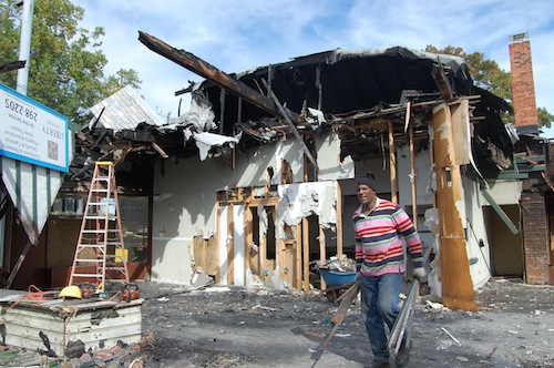 Crews carry a way debris from the building. (Cyndi Murray photos)