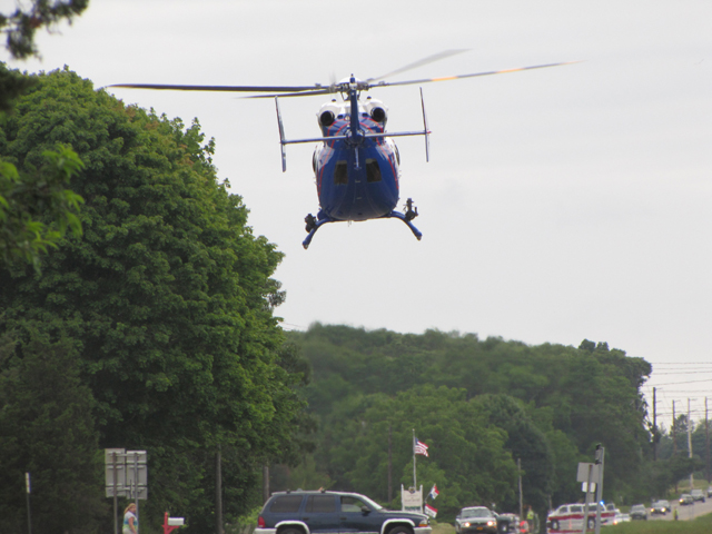 A Suffolk County police helicopter transports a victim from Saturday's crash. (Credit: TIm Gannon)